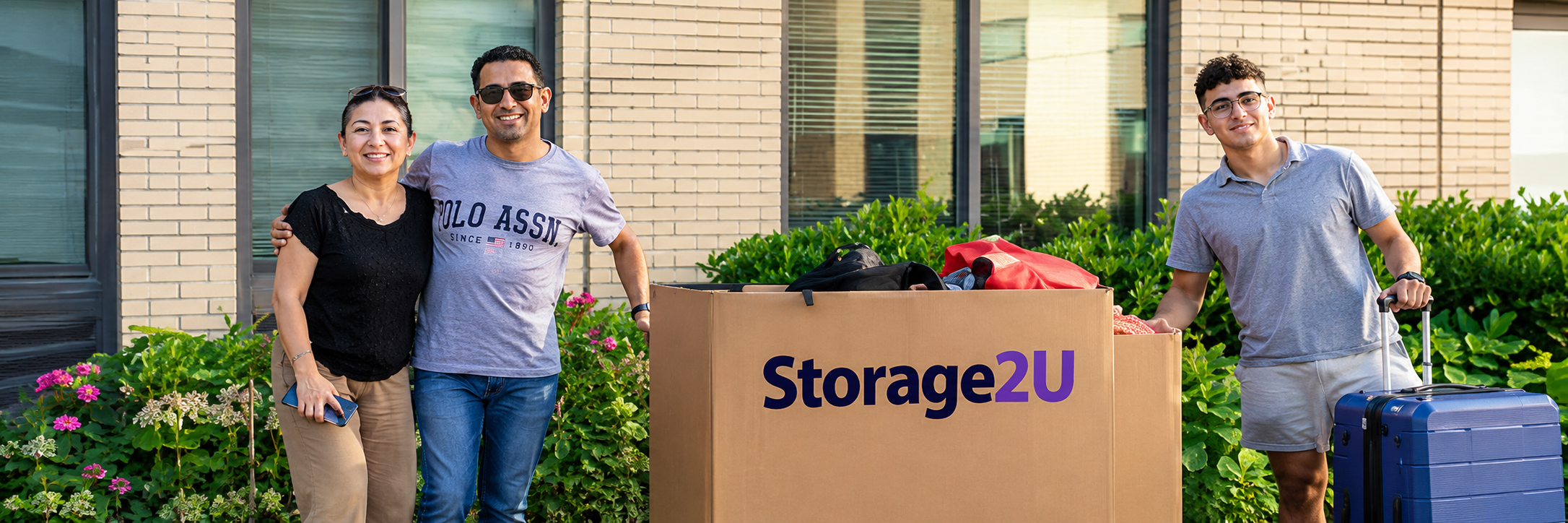 Family and student with a Storage2U moving box on move-out day